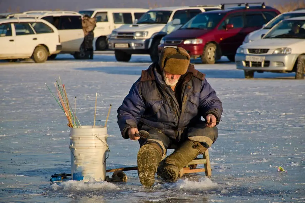 Photo of Ice Fishing Sitting on a Bucket