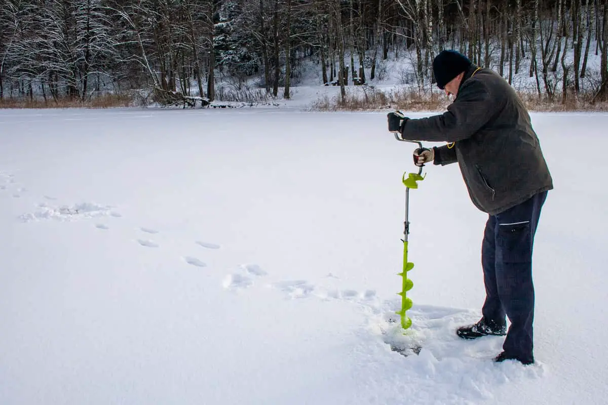 Photo of Man Using Hand Ice Auger