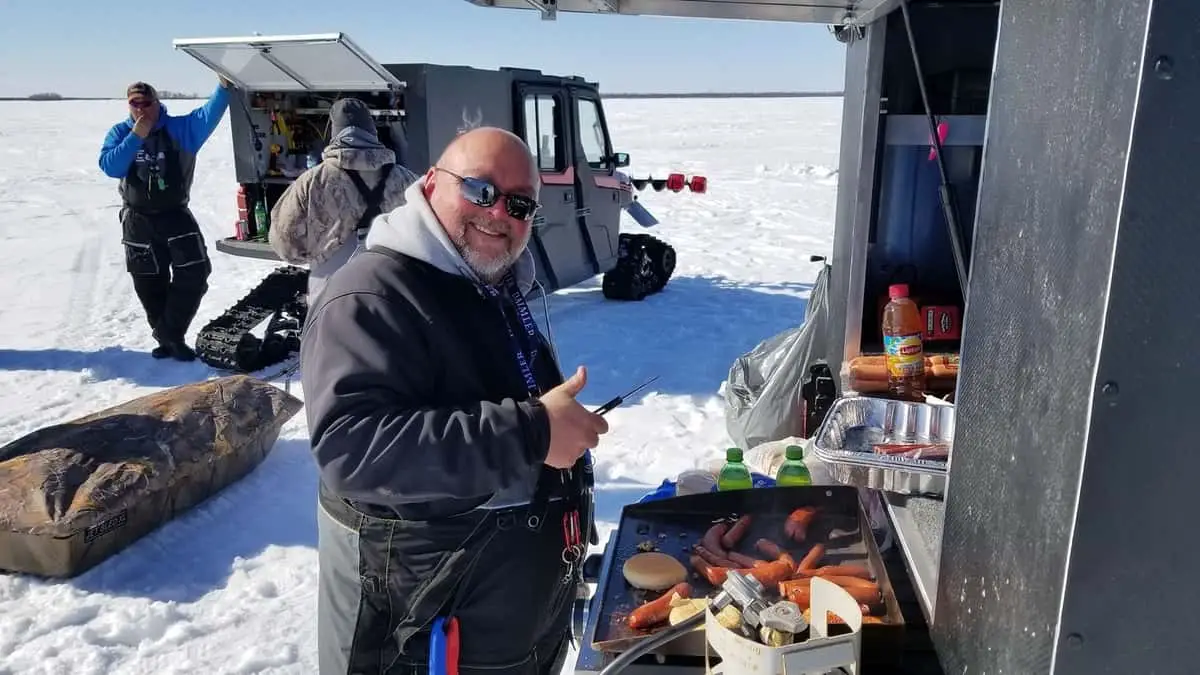 Photo of Man Cooking on Ice With Blackstone Grill